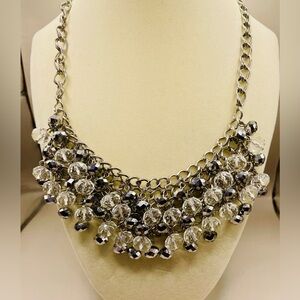Silver tone bib necklace with crystal tassels. 18 inches long. 3 inch extender.